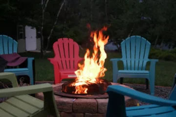 Colorful Adirondack chairs, as shown here, are some of the best fire pit chairs