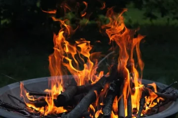Wood burning in an outdoor fire pit - How Far Should A Fire Pit Be From Your House